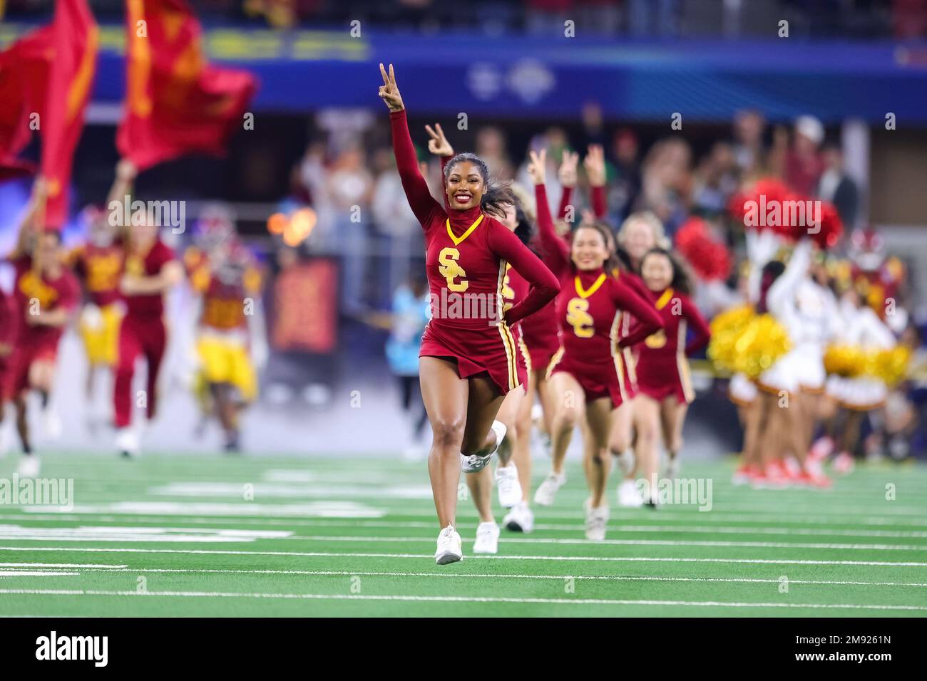 Southern California Trojans cheerleaders led the team out on the field during the 87th Goodyear Cotton Bowl Classic at AT&T Stadium Monday, January 2, Stock Photo
