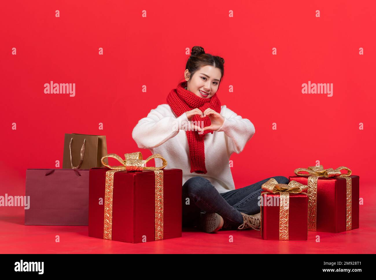 Happy young woman with a gift Stock Photo - Alamy