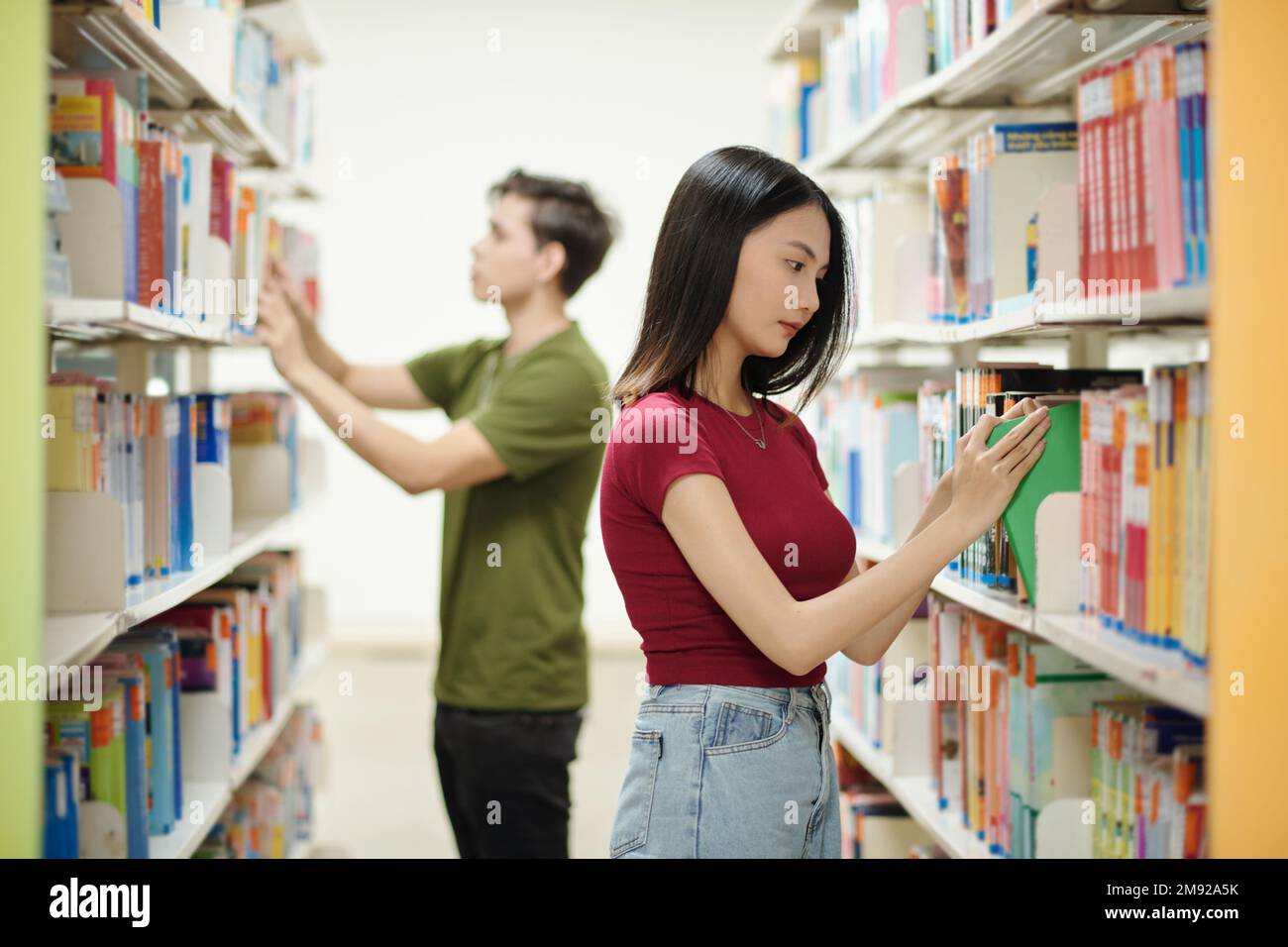 Students in school library searching for books to read after class ...