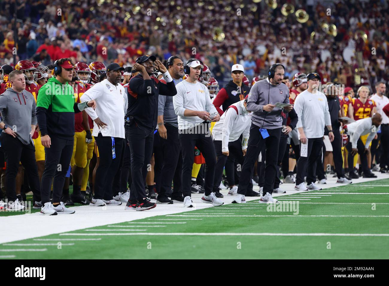 Southern California Trojans head coach Lincoln Riley (center with white