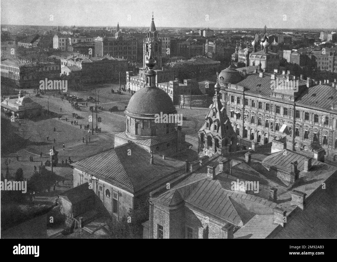 Strastnaya Square with its surroundings. In the foreground is the Church of Dmitry Thessalonica at the corner of Tverskaya and Tverskoy Boulevard. Behind it, on the square - the Passion Monastery; To the left of his cathedral is the Church of the Nativity in Putinki on Malaya Dmitrovka, and further along this street is the Merchant Club. In the depths at the left edge, the high hipped roofs of the Loan Treasury building in Nastasinsky Lane have already risen; it was built in 1915-1916, which helps to date the shooting. ca.  between 1915 and 1916 Stock Photo