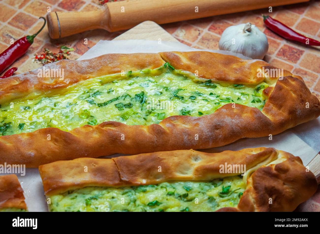 Pide, cheese pide, kasarli pide. Turkish pide with cheese. Turkish pizza, cheese pita on white background. Stock Photo