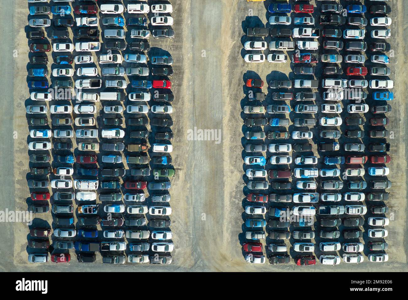 Aerial view of auction reseller company big parking lot with parked