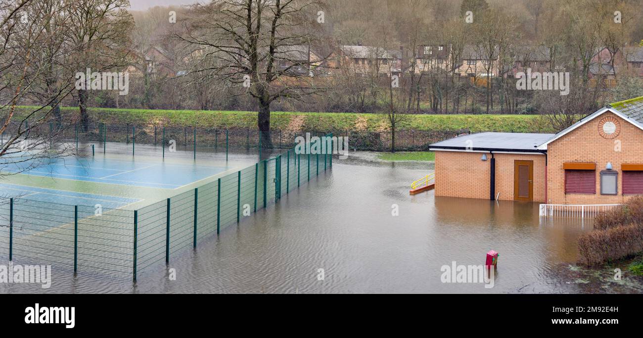 Taffs Well, Cardiff, Wales - January 2023: Village tennis court underwater after flooding from the River Taff Stock Photo