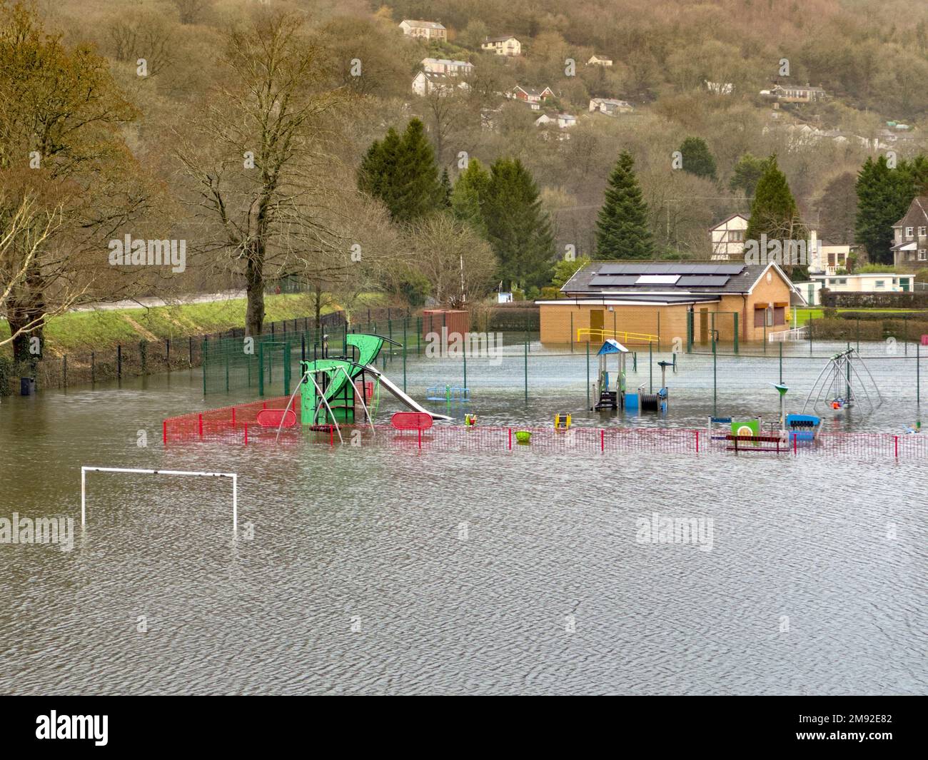 Taffs Well, Cardiff, Wales - January 2023: Children's playground in the village underwater after flooding from the River Taff Stock Photo