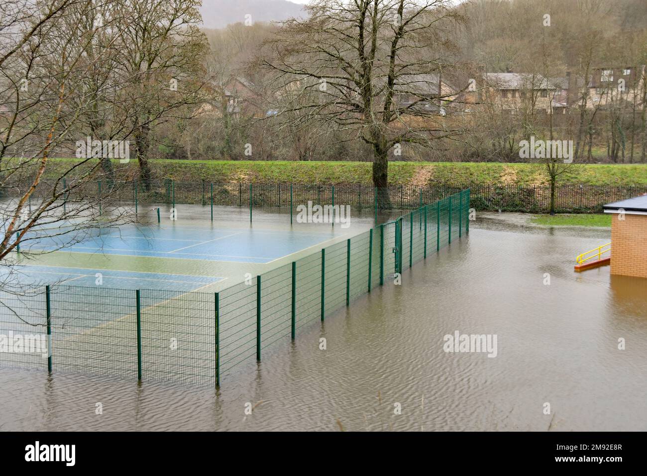 Taffs Well, Cardiff, Wales - January 2023: Village tennis court underwater after flooding from the River Taff Stock Photo