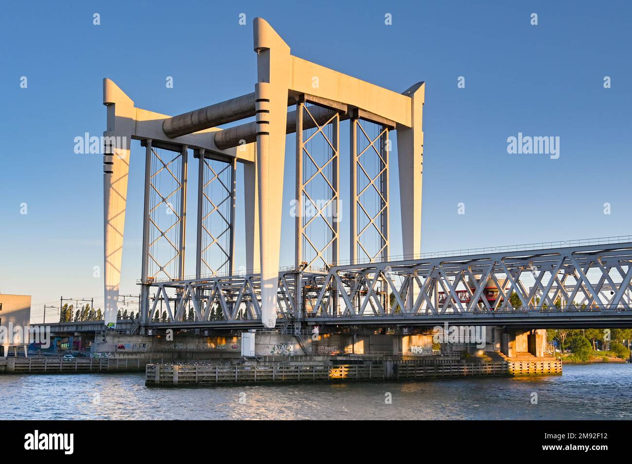 Dordrecht, Netherlands - August 2022: Vertical lifting bridge which lifts railway tracks to allow ships to pass on the river. Stock Photo