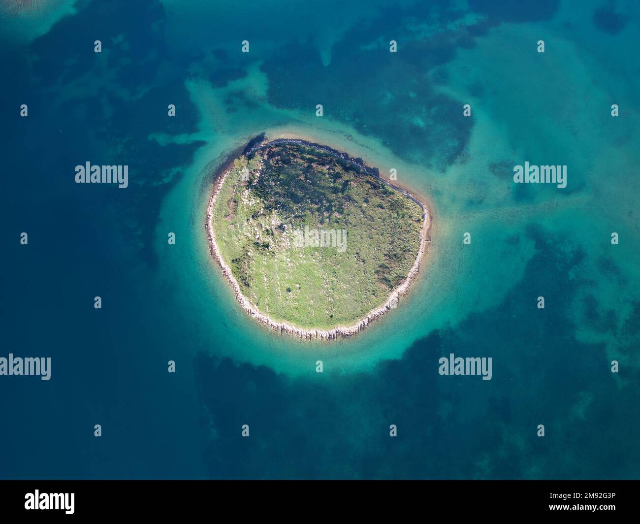 Aerial drone view of a small Island in Croatia with beautiful blue ...