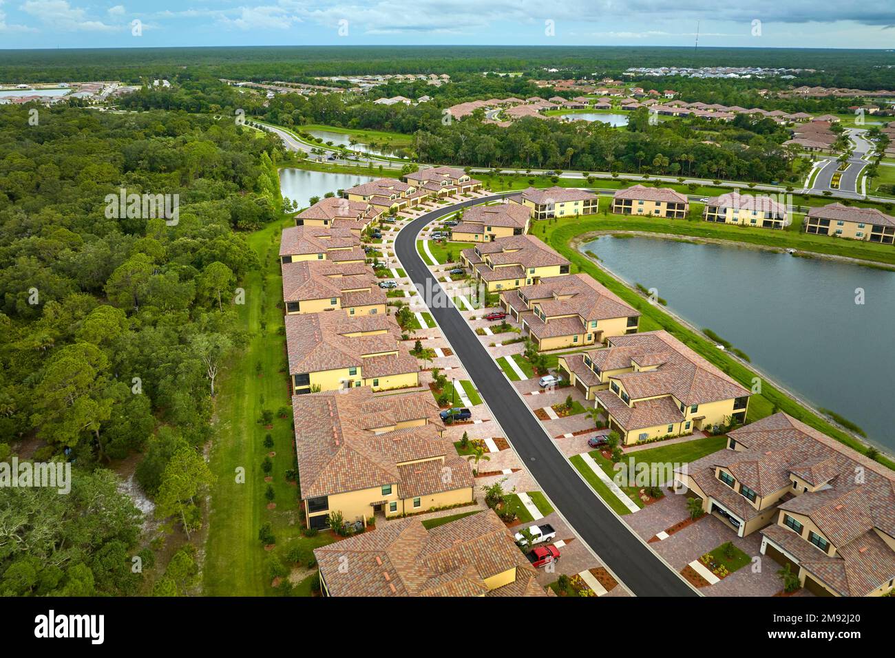 Aerial view of tightly located family houses in Florida closed suburban