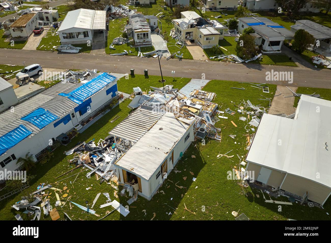Badly damaged mobile homes after hurricane Ian in Florida residential