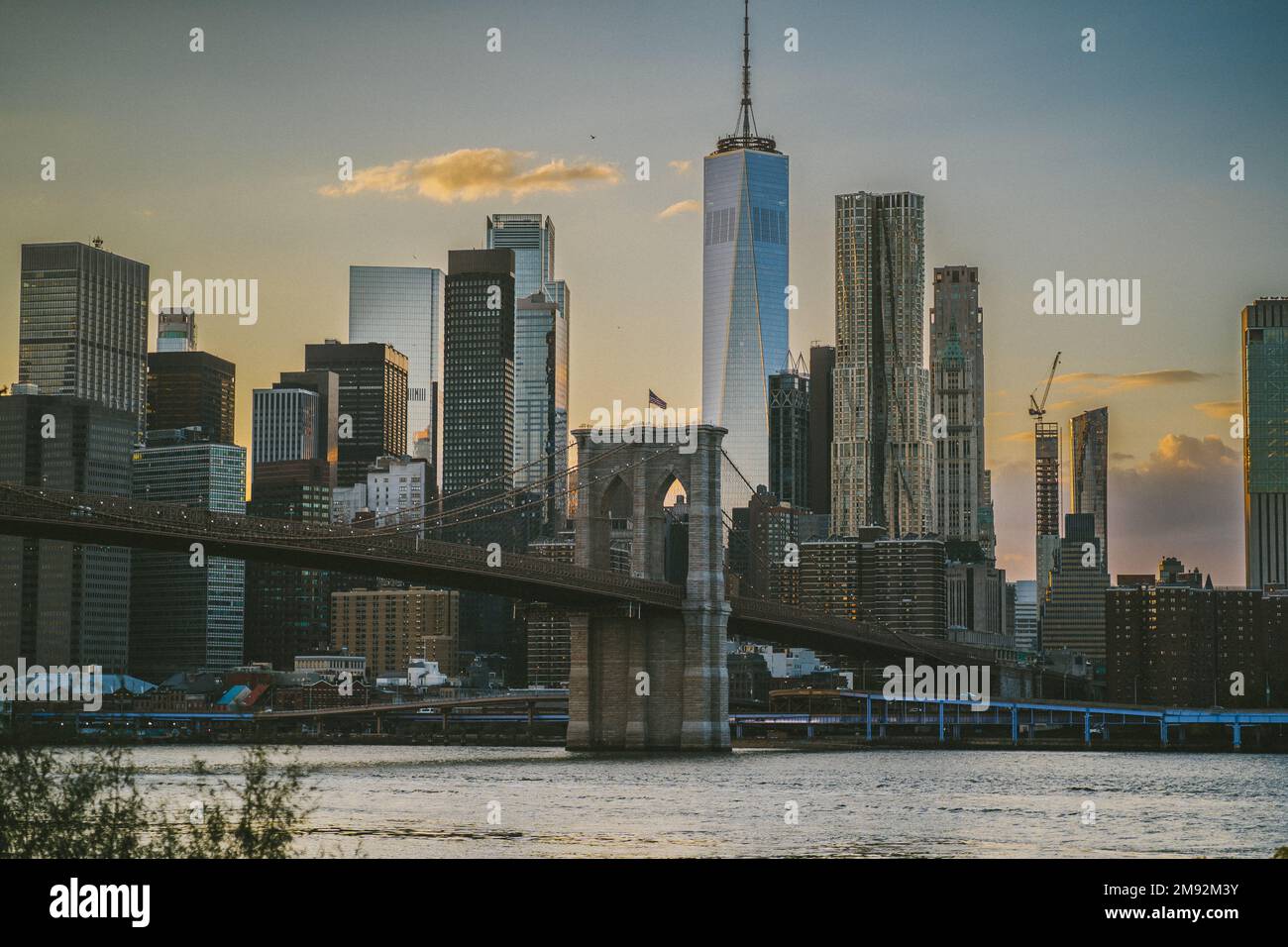 High rise buildings located near Brooklyn Bridge against cloudless
