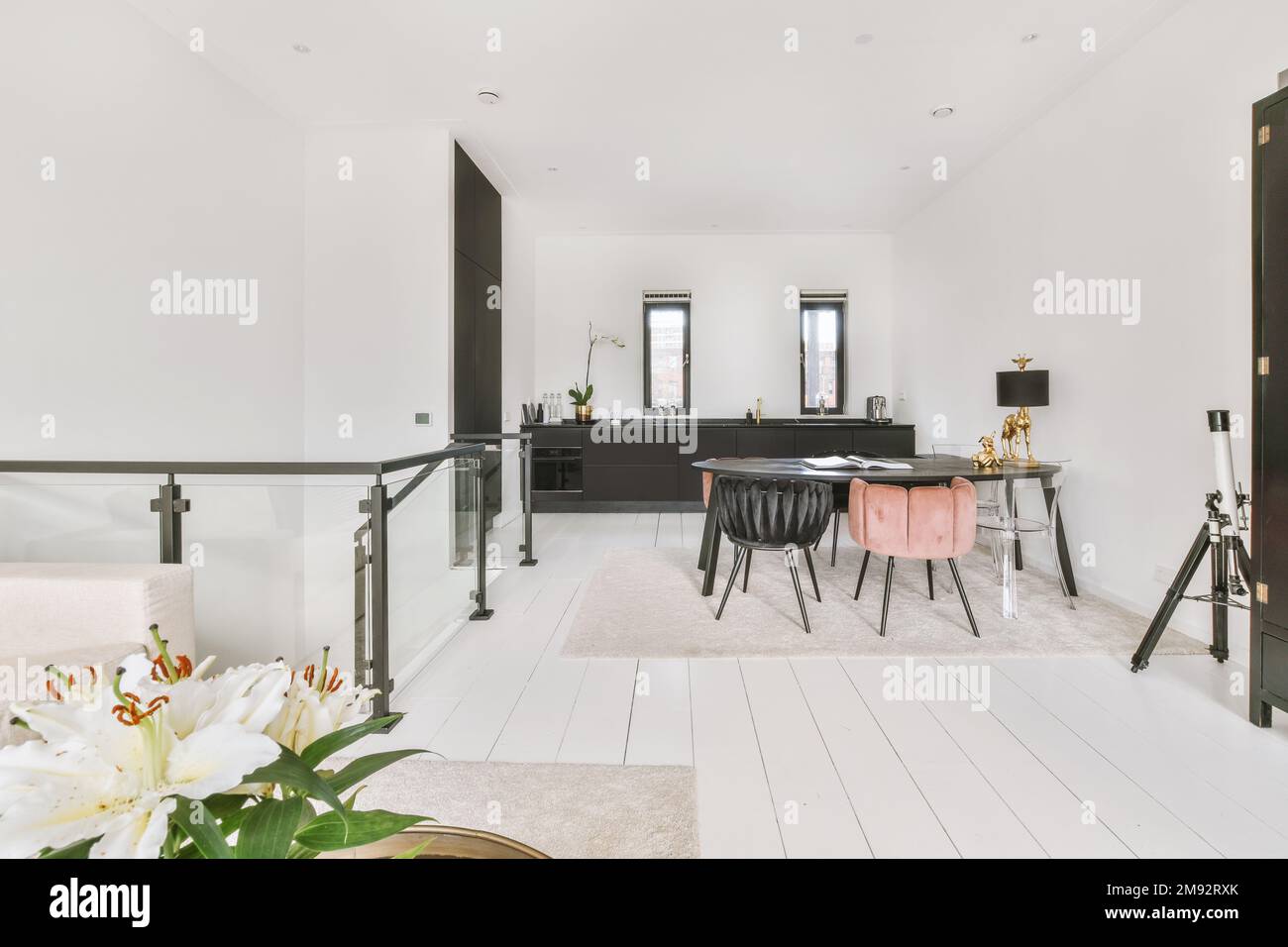 Spacious open plan kitchen with white walls and beautiful living room ...