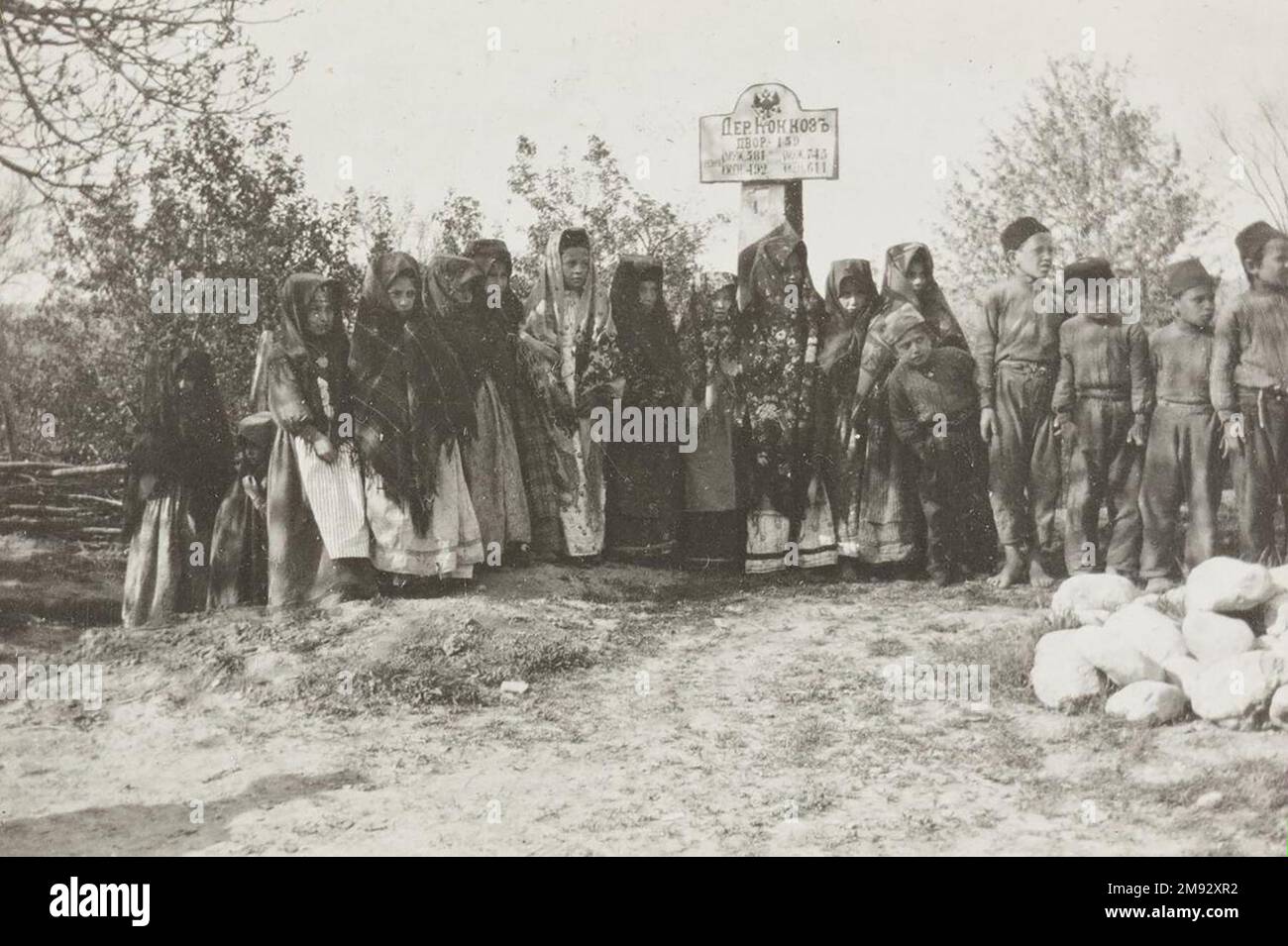 Children at the entrance to the village of Kokkoz, probably in Crimea ca.  1914 Stock Photo