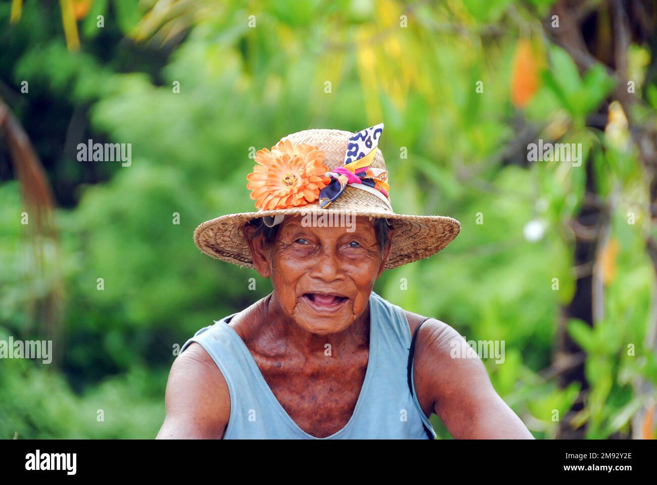 Bali, Indonesia - circa February 2017: Portrait of a balinese old woman looking at camera Stock Photo