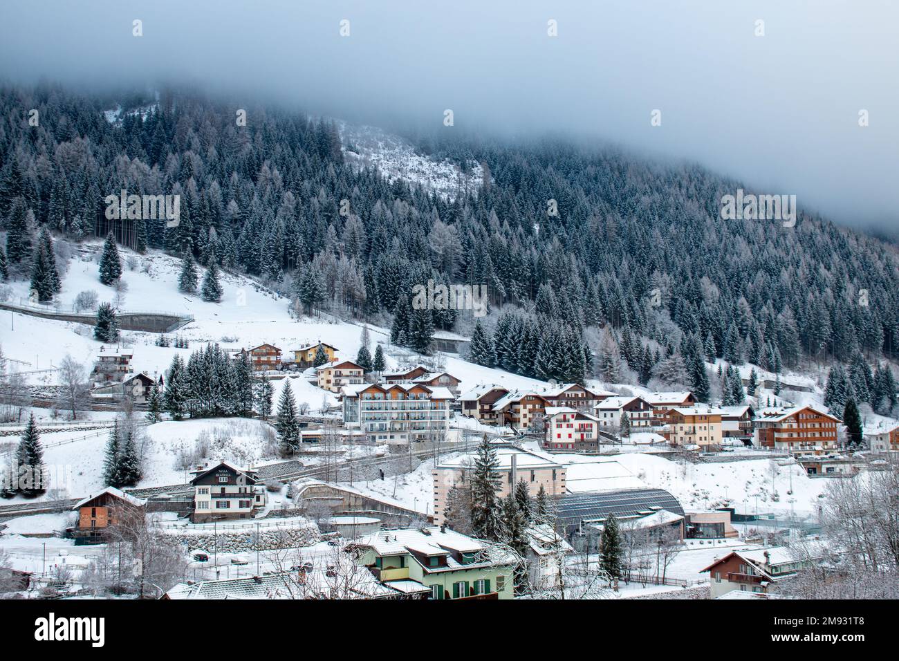 Cottages and chalets of Moena in Italian Dolomites in January under the
