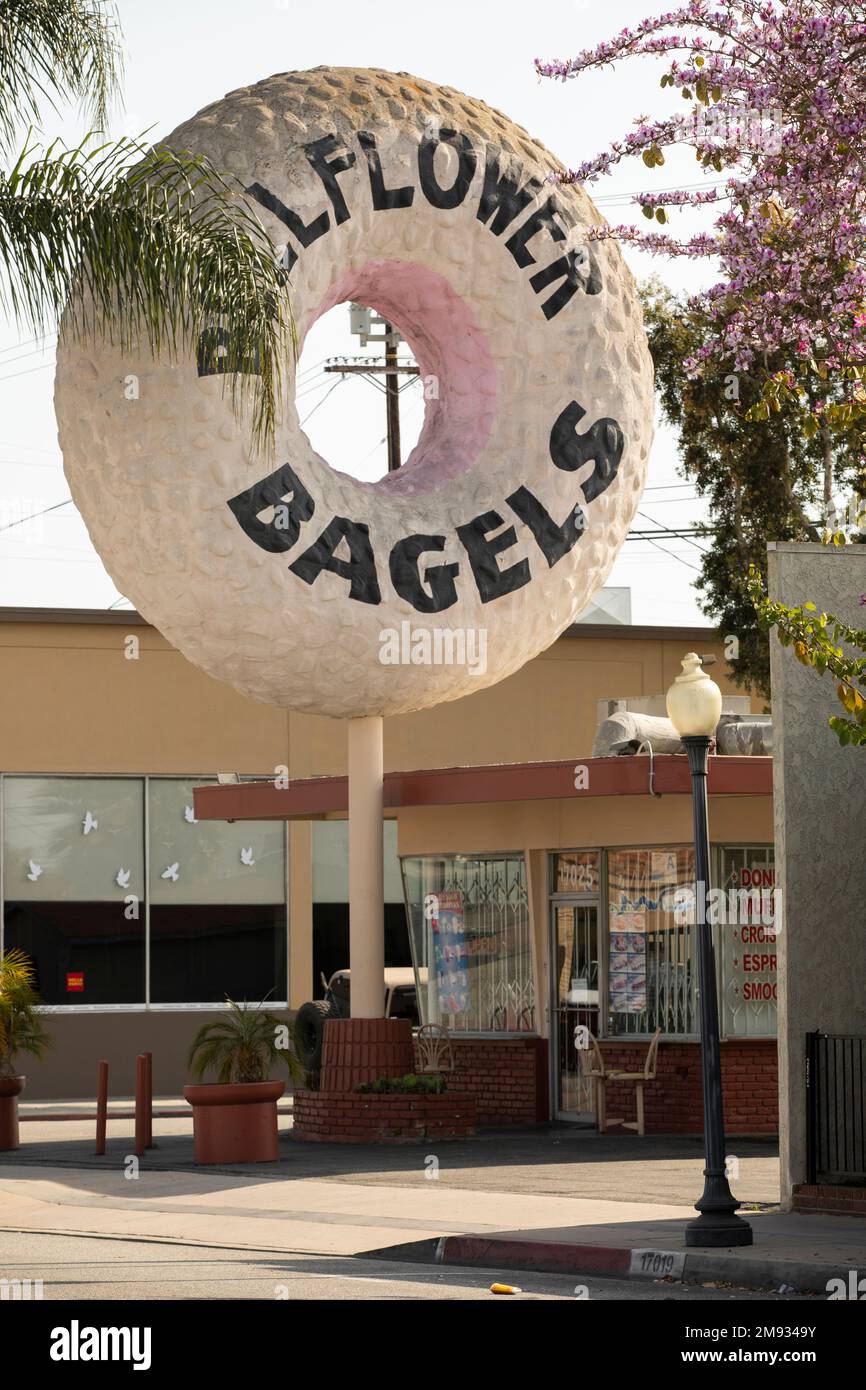 Bellflower, California, USA - May 2, 2021: Afternoon sun shines on a famous bagel shop in downtown Bellflower. Stock Photo