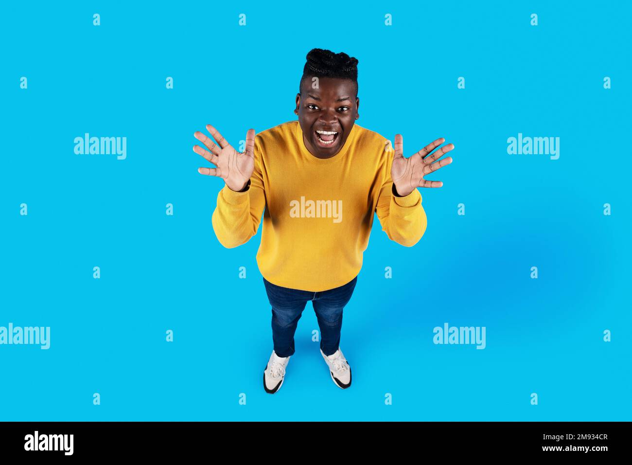 Spread Up Above Shot Of Young African American Man Spreading Hands With ...