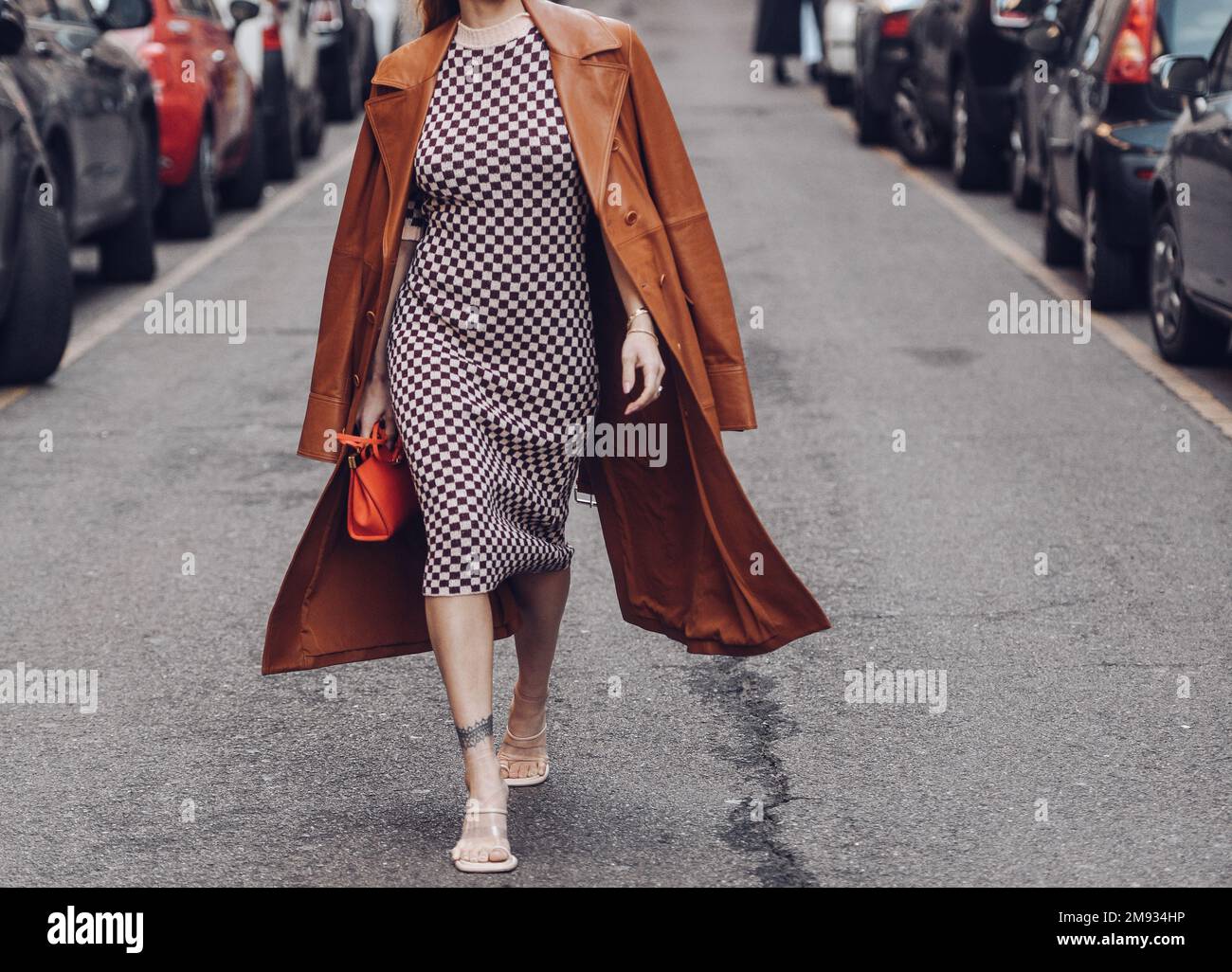 MILAN, ITALY - SEPTEMBER 20, 2019: Woman with brown Louis Vuitton checkered  bag, white dress and Dior bracelets before Sportmax fashion show, Milan Fa  Stock Photo - Alamy