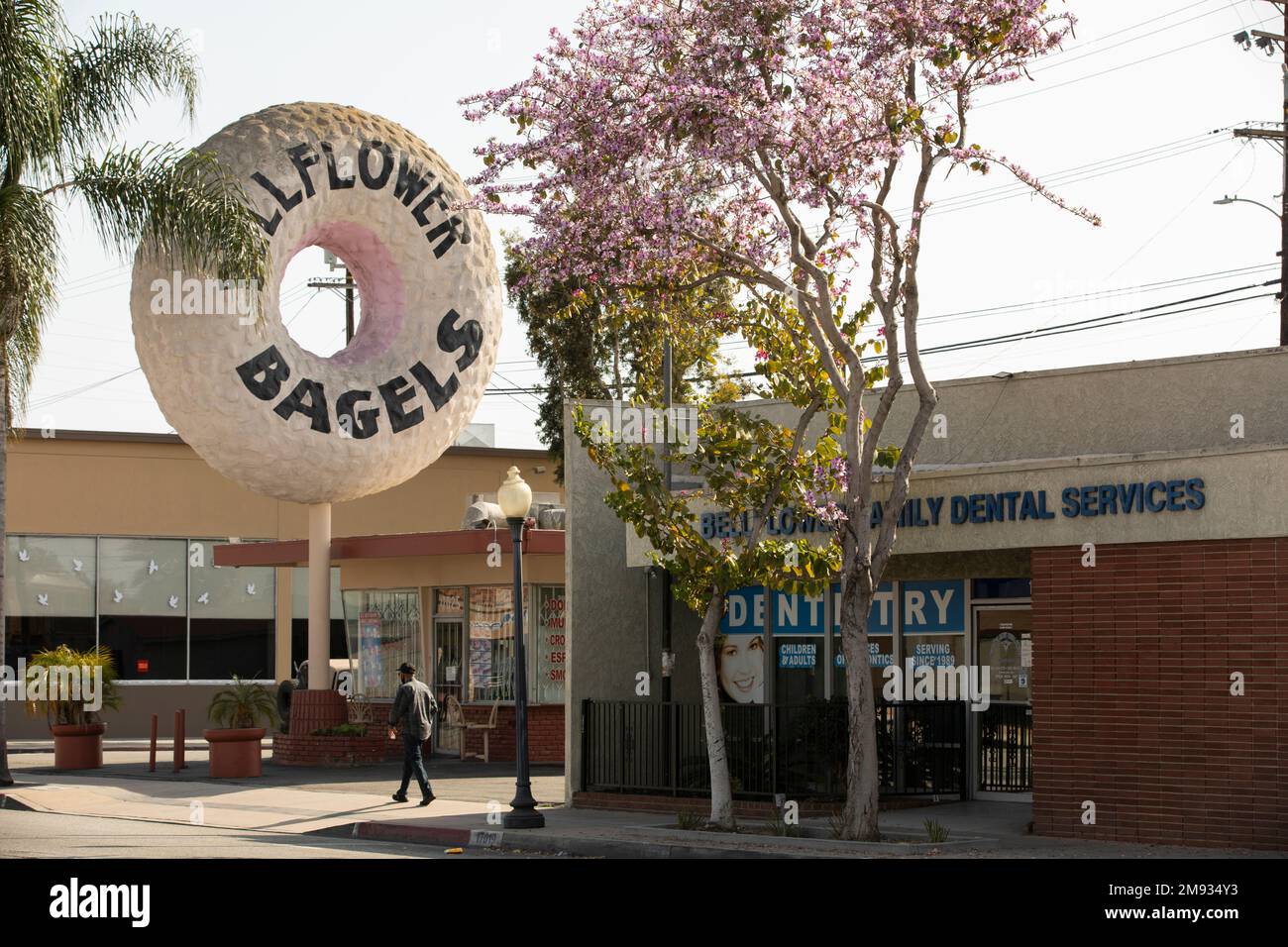 Bellflower, California, USA - May 2, 2021: Afternoon sun shines on a famous bagel shop in downtown Bellflower. Stock Photo