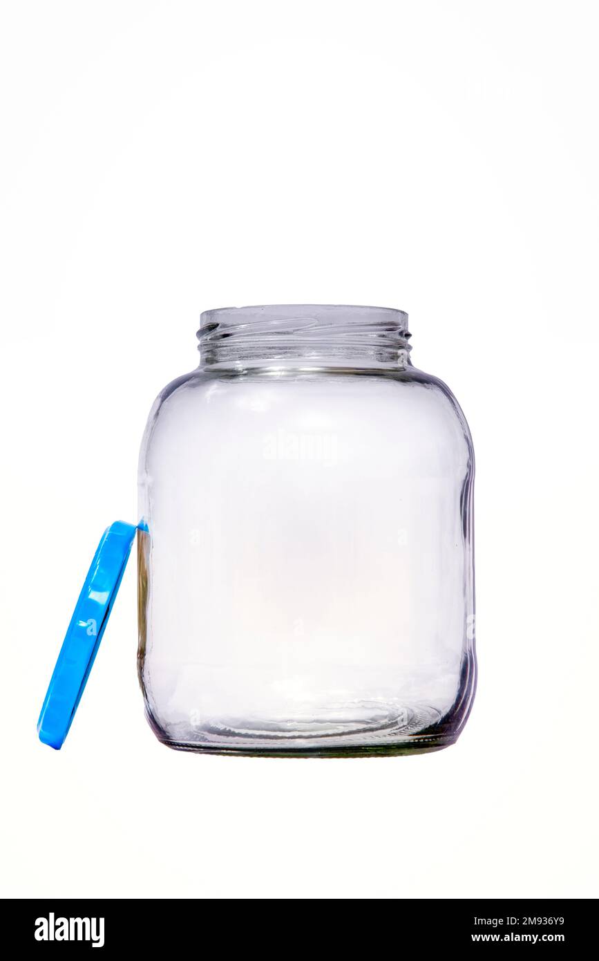 An empty pickle jar with adjacent lid isolated on white with copy space. Stock Photo