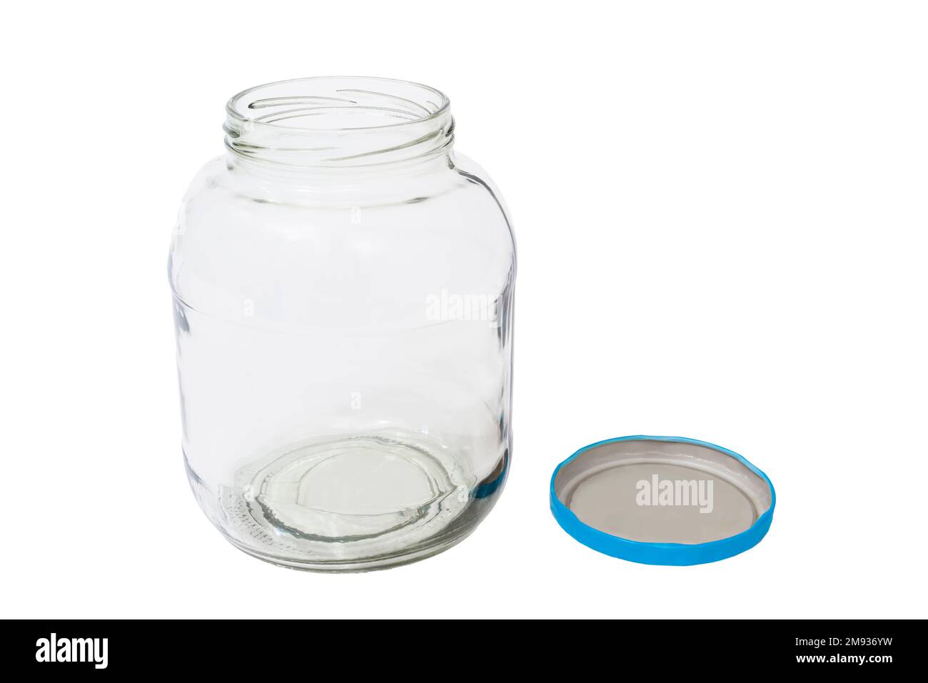 An empty pickle jar shot from slightly above with its lid to the side.  Both are isolated on white with copy space. Stock Photo
