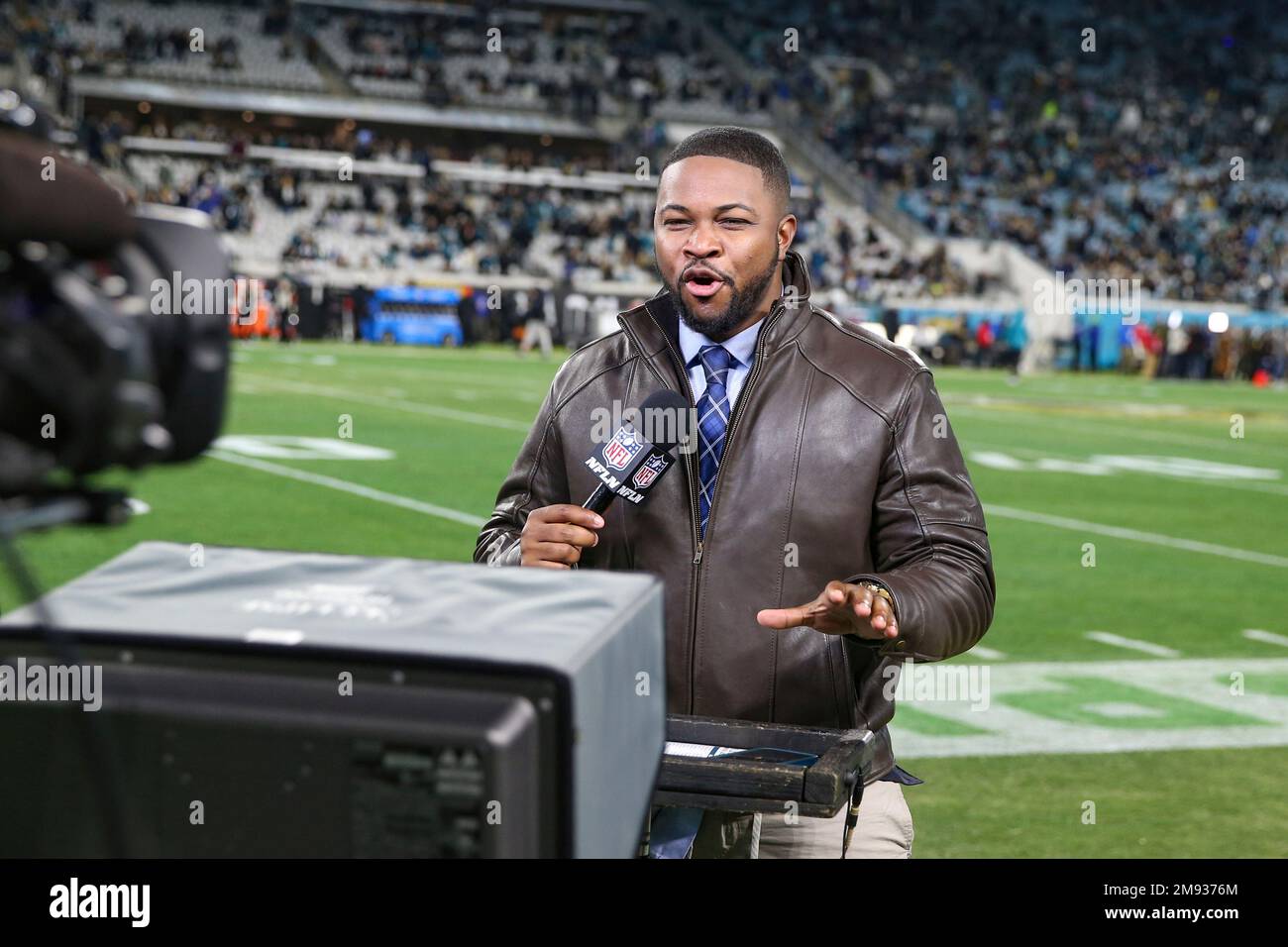NFL Network's Cameron Wolfe reports from the sideline before an NFL  wild-card football game against the Los Angeles Chargers, Saturday, Jan. 14,  2023, in Jacksonville, Fla. The Jaguars defeated the Chargers 31-30. (
