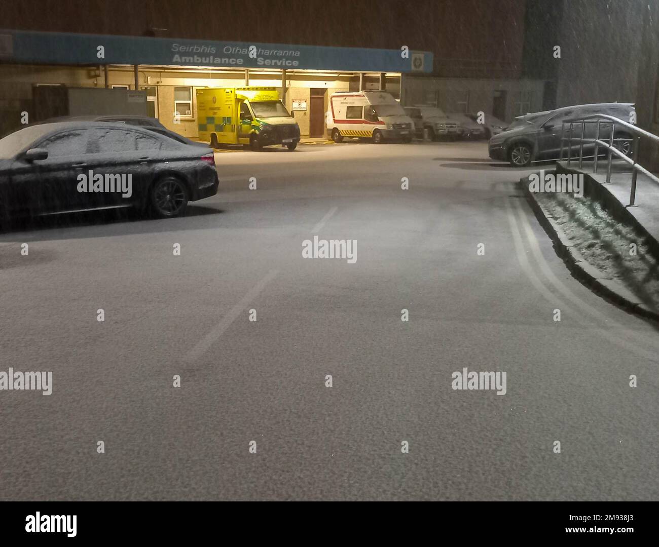 Bantry, West Cork, Ireland, Monday 16 Jan 2023; Light snow fell in Bantry this evening.  It stuck to the ground making driving conditions hazardous. People where reminded to use dipped headlights and to keep extra distance to the car in Front. Snow on the ground at Bantry Ambulance Base. Credit; ED/Alamy Live News Stock Photo