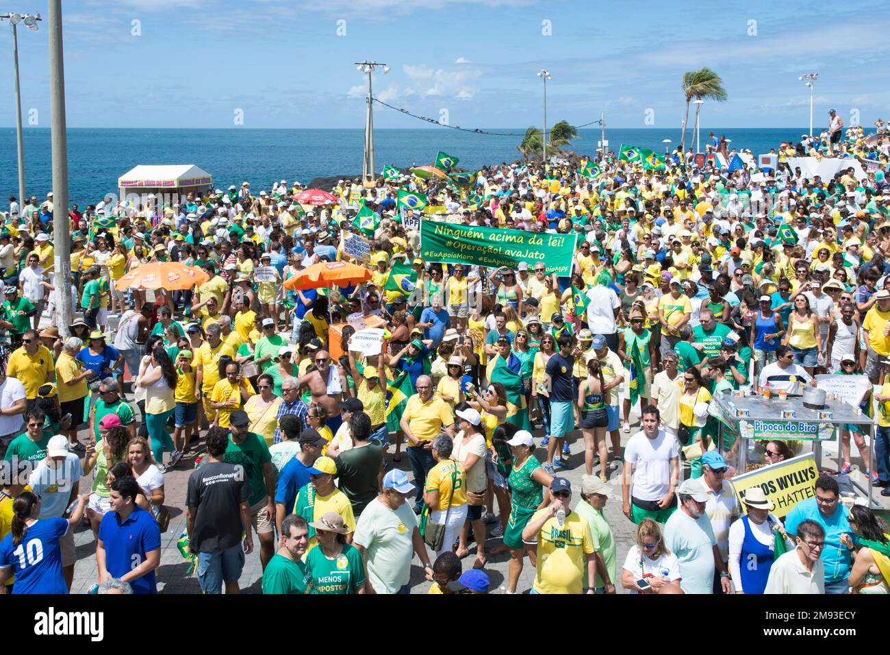 Salvador, Bahia, Brazil - March 13, 2016: Big crowd of activists with Brazilian flags attend a demonstration for the impeachment of Dilma Rousseff Stock Photo
