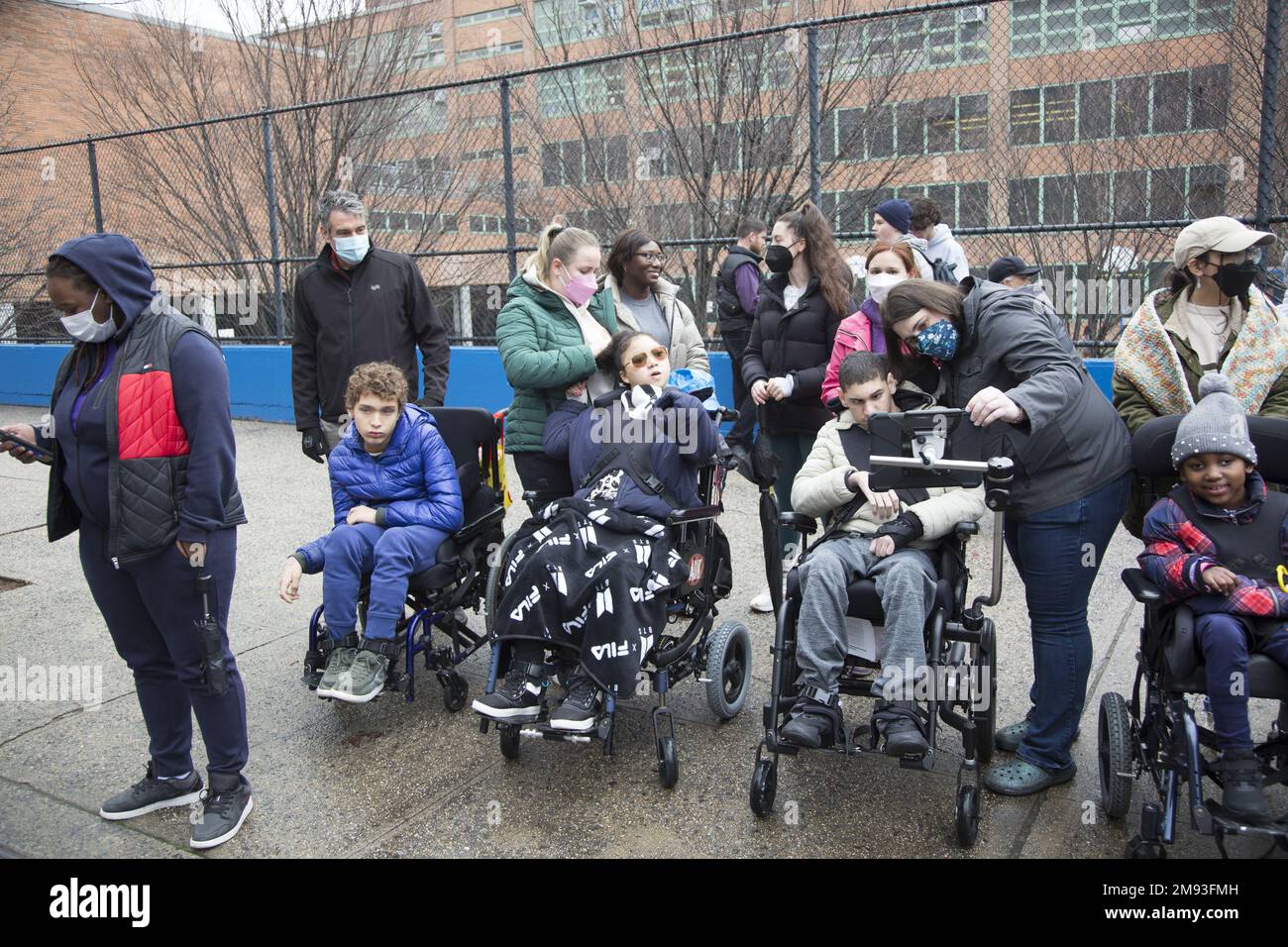 Students with multiple disabilitioes from the Pathway Childrens School watching the 2023 Three Kings Day Parade along 3rd Avenue in Spanish Harlem, hosted by El Museo del Barrio, New York’s leading Latino cultural institution. One of the El Museo del Barrio large artistic puppets that lead the parade each year. Stock Photo