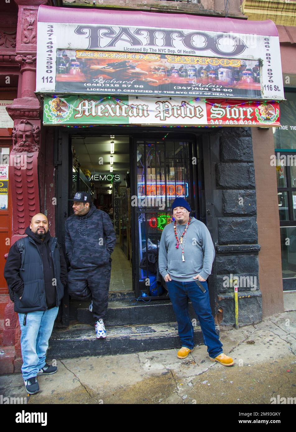 Tattoo parlor artist and owner (center) on East 116th Street