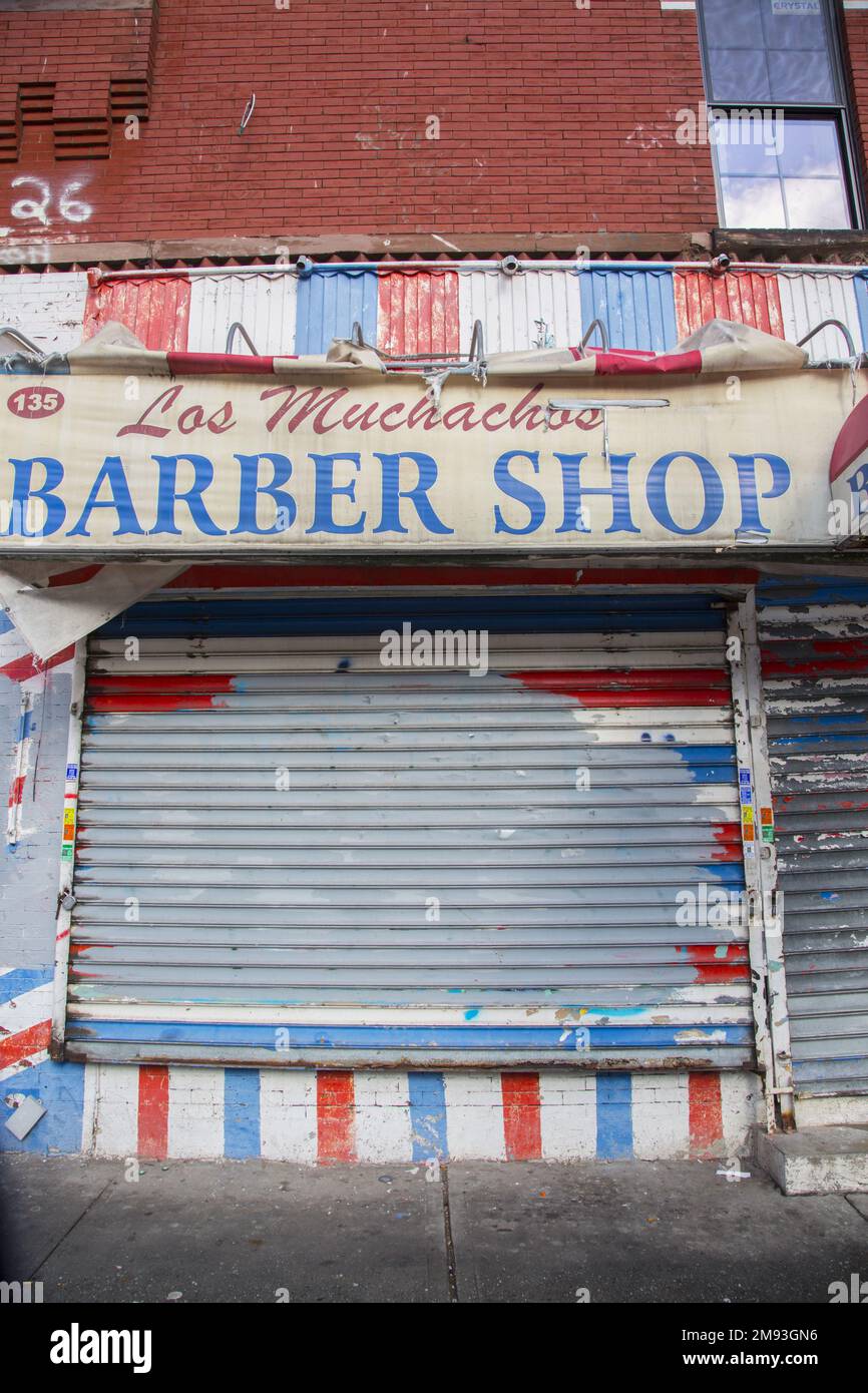 Closed up barber shop in East Harlem, New York City. Stock Photo