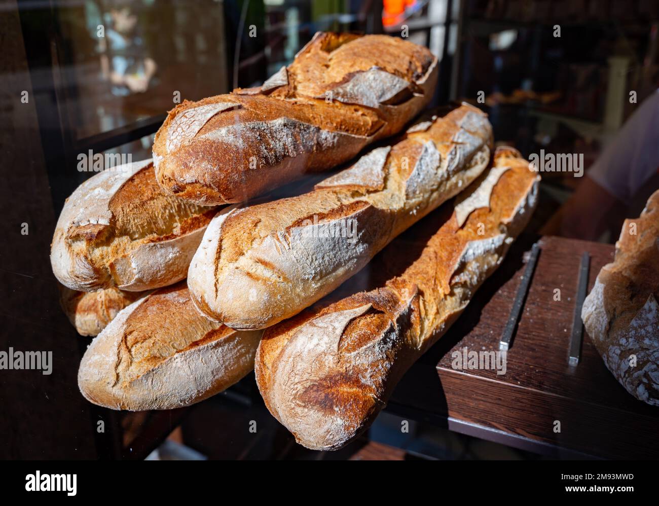 French bakery in Lyon, many fresh baked baguettes breads ready for sale  close up Stock Photo - Alamy