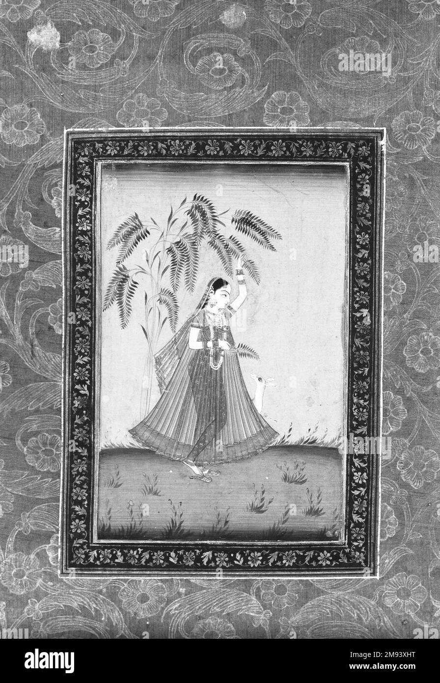 Girl with a Deer (Todi Ragini ?) Indian. Girl with a Deer (Todi Ragini ?), 1875-1900. Opaque watercolor and gold on paper, sheet: 19 11/16 x 11 3/4 in. (50.0 x 29.8 cm).   Asian Art 1875-1900 Stock Photo