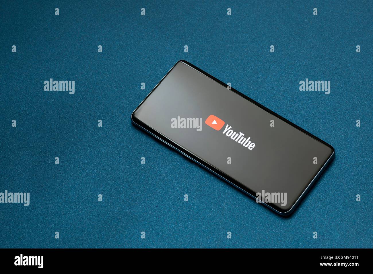 Mexico ,CDMX - April 30, 2022: Cell phone on a blue base with the