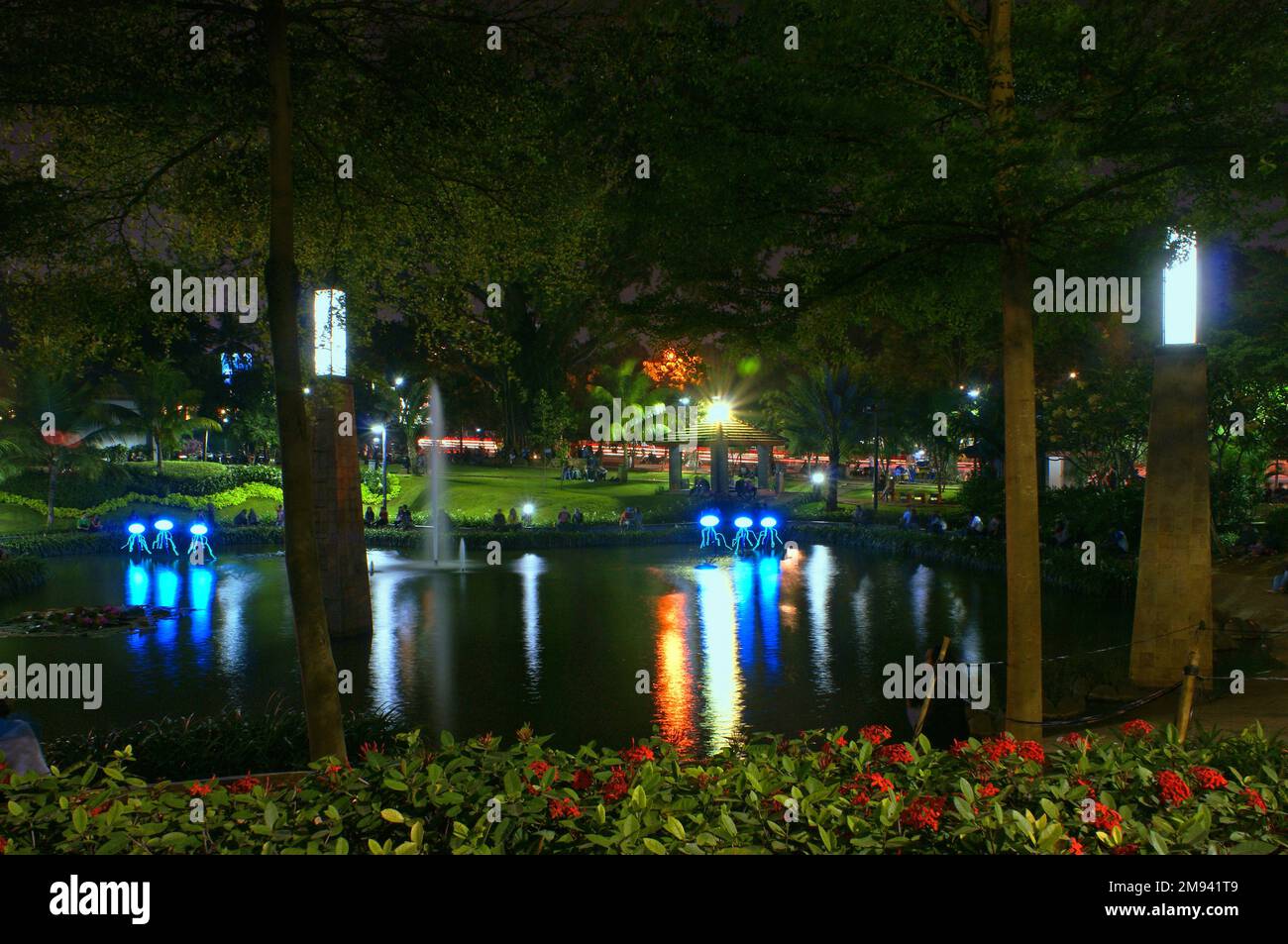 Park and Fountain at Night at Barito, Jakarta, Indonesia Stock Photo