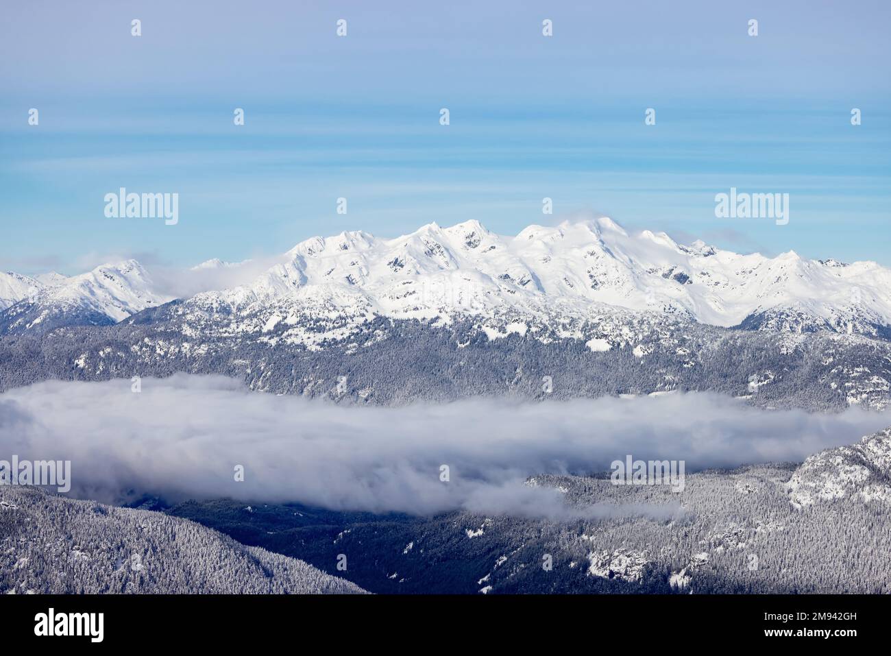 Snow and Cloud covered Canadian Nature Landscape Background. Winter Season in Whistler Stock Photo