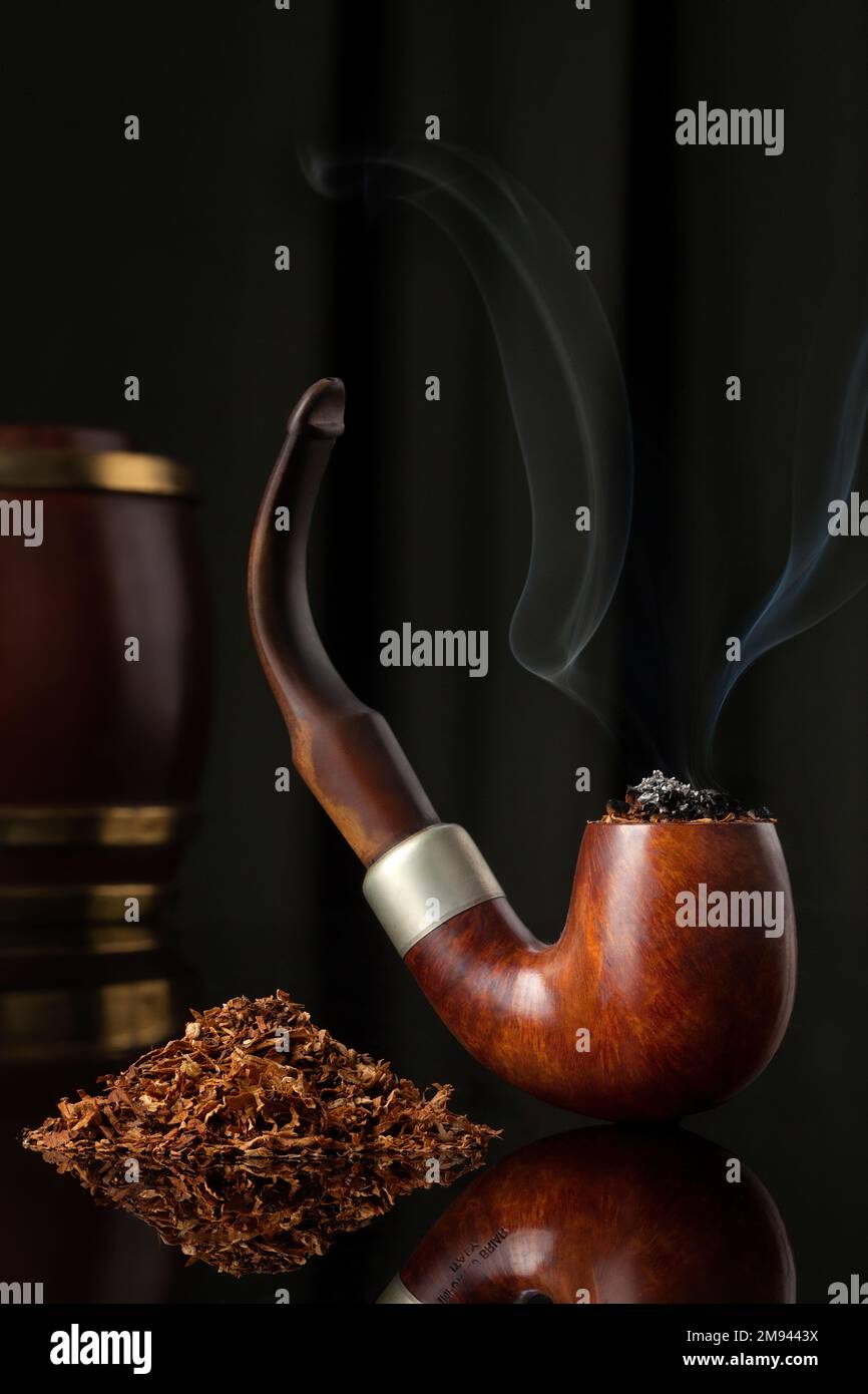 LIt Wooden Elegant Brown Tobacco pipe with tobacco and tobacco wooden