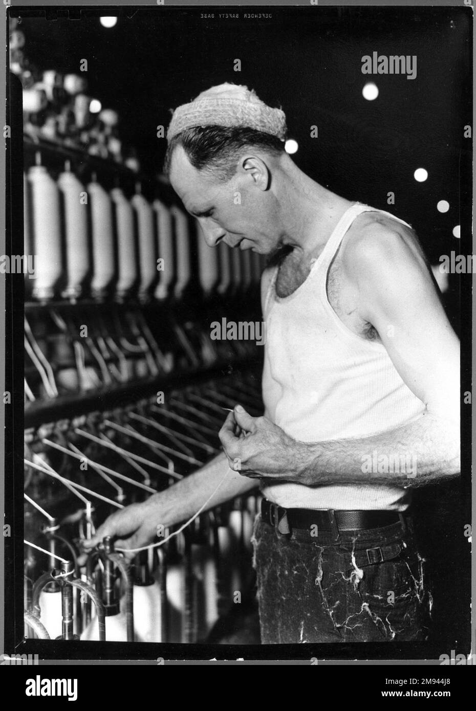 [Untitled] (Man in Cap Holding Thread) Lewis Wickes Hine (American ...