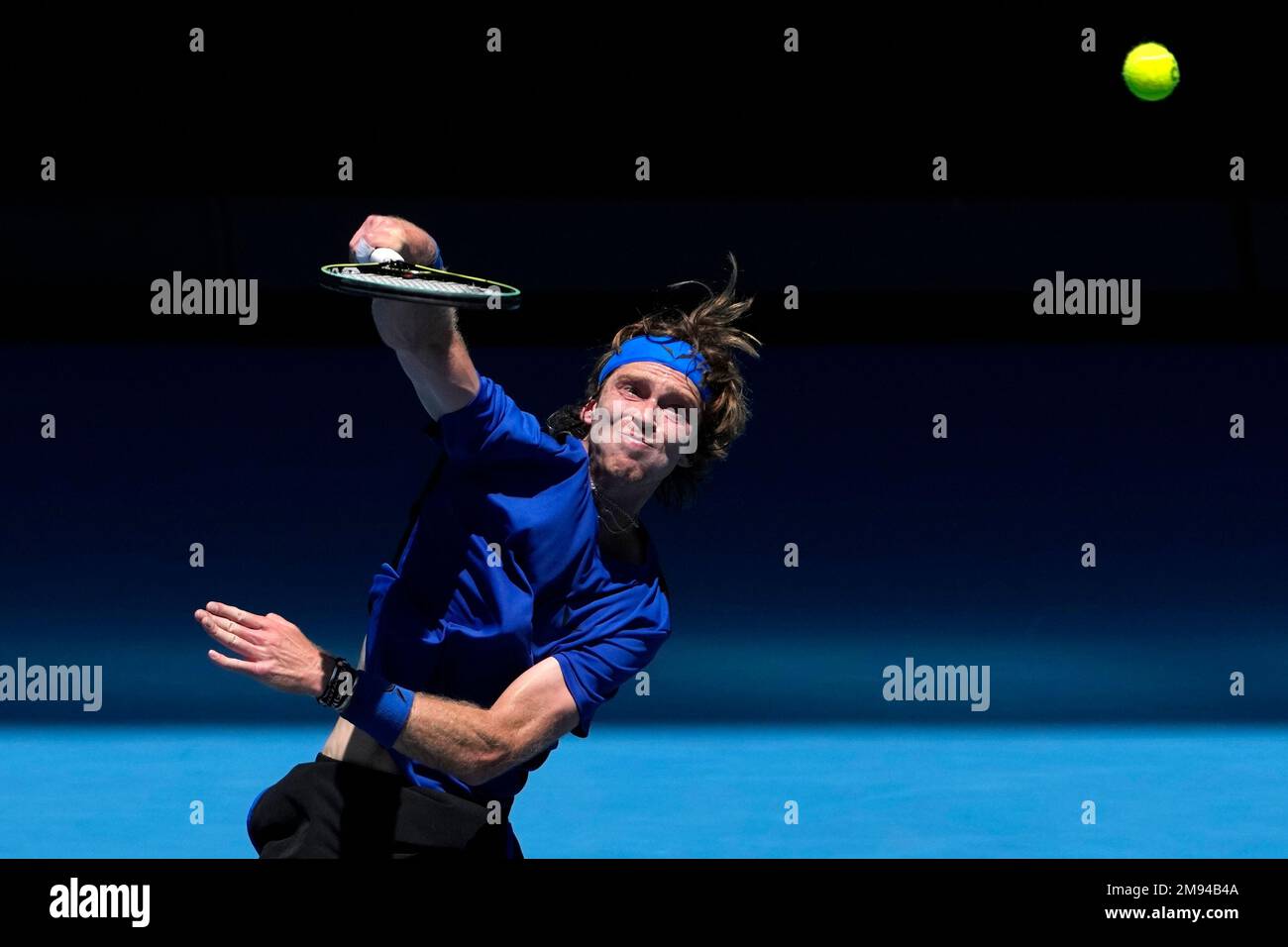 Andrey Rublev of Russia plays a forehand return to Dominic Thiem of Austria during their first round match at the Australian Open tennis championship in Melbourne, Australia, Tuesday, Jan