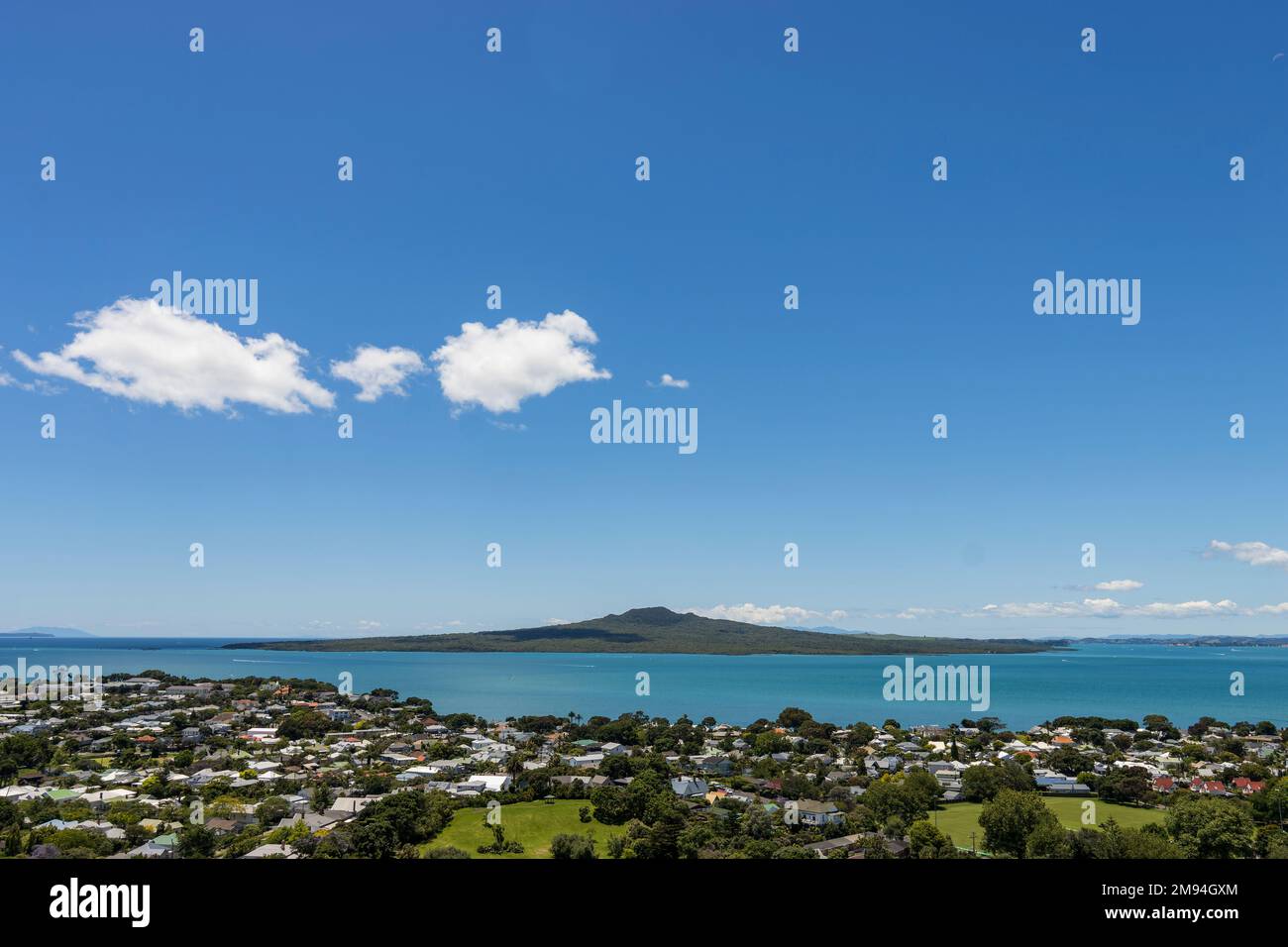 Rangitoto Island in Auckland, New Zealand from Devonport, It is summertime and the sun is high. Stock Photo
