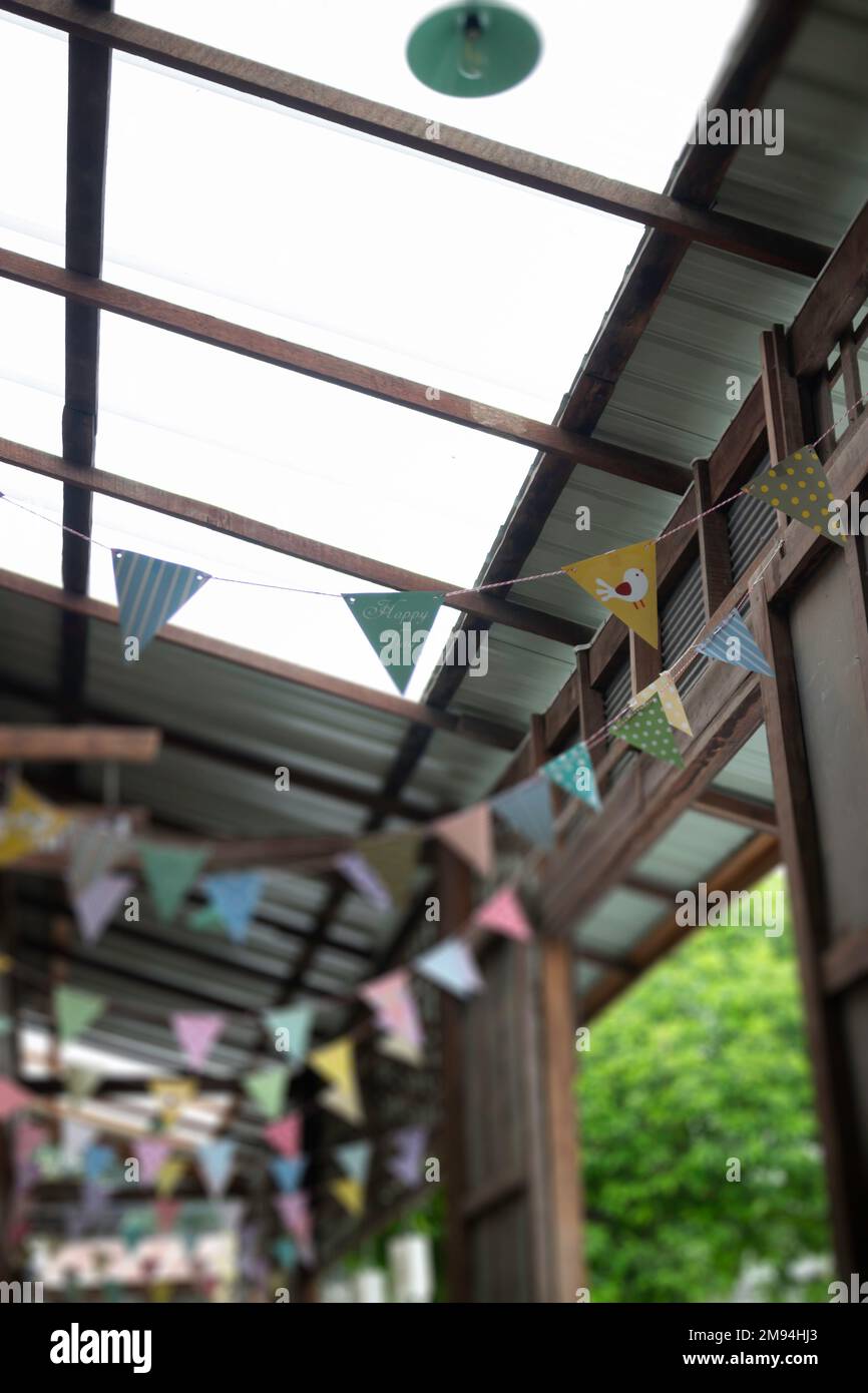 Festive colorful flags decorated on wooden architecture, stock photo ...