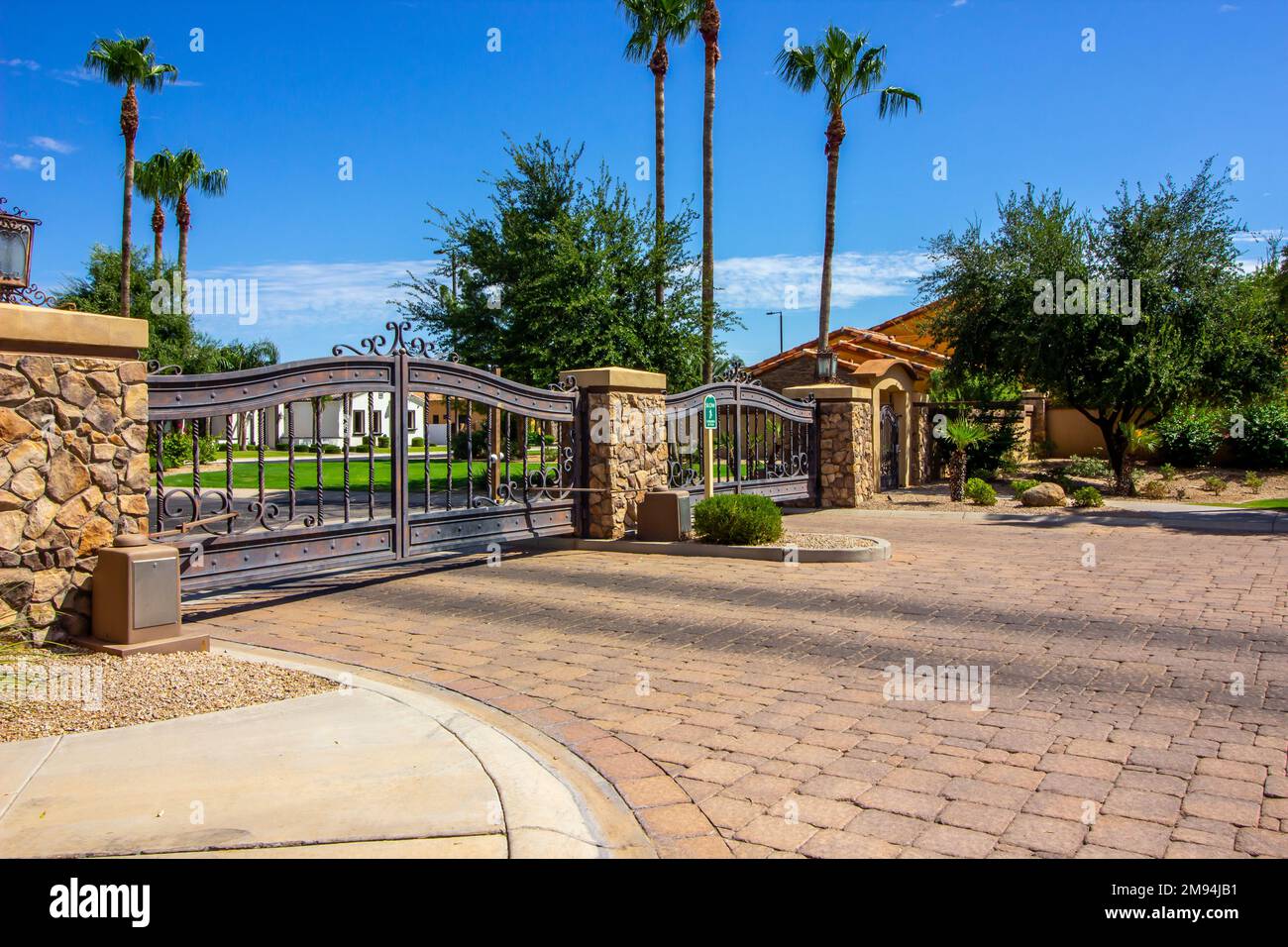 Metal Security Entrance/Exit Gates At Secure Housing Subdivision Stock