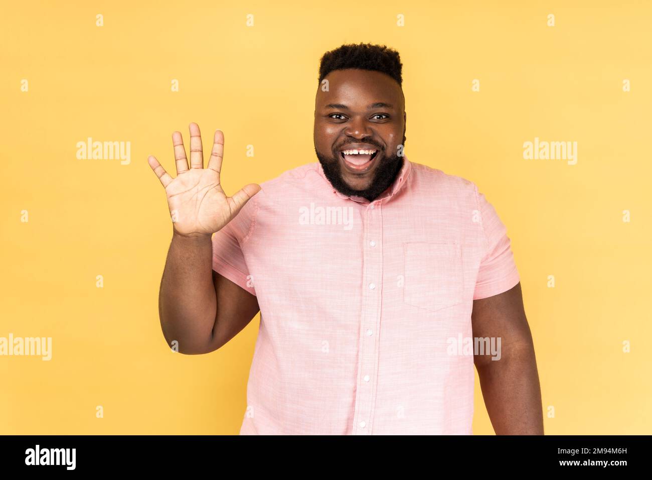 Bearded man in yellow shirt hi-res stock photography and images - Alamy