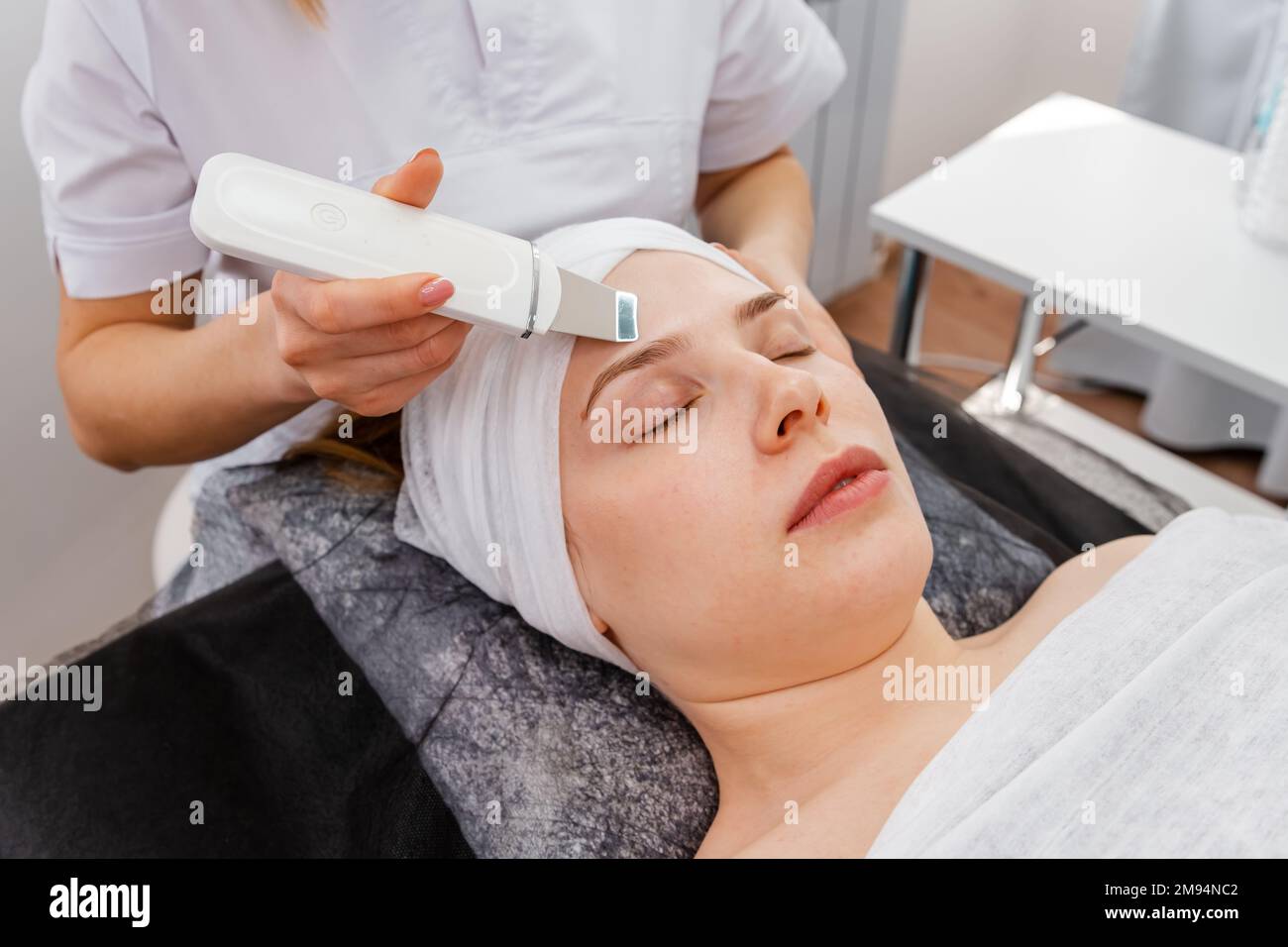 Woman getting ultrasound face hi-res stock photography and images - Alamy
