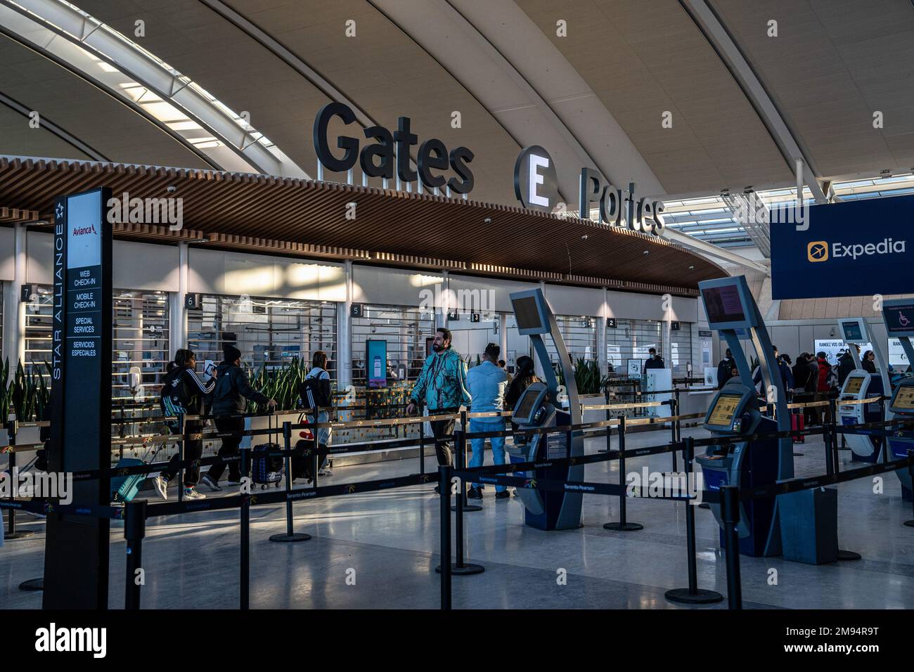 Toronto, Canada. 16th Jan, 2023. People walk past Gates E at the YYZ