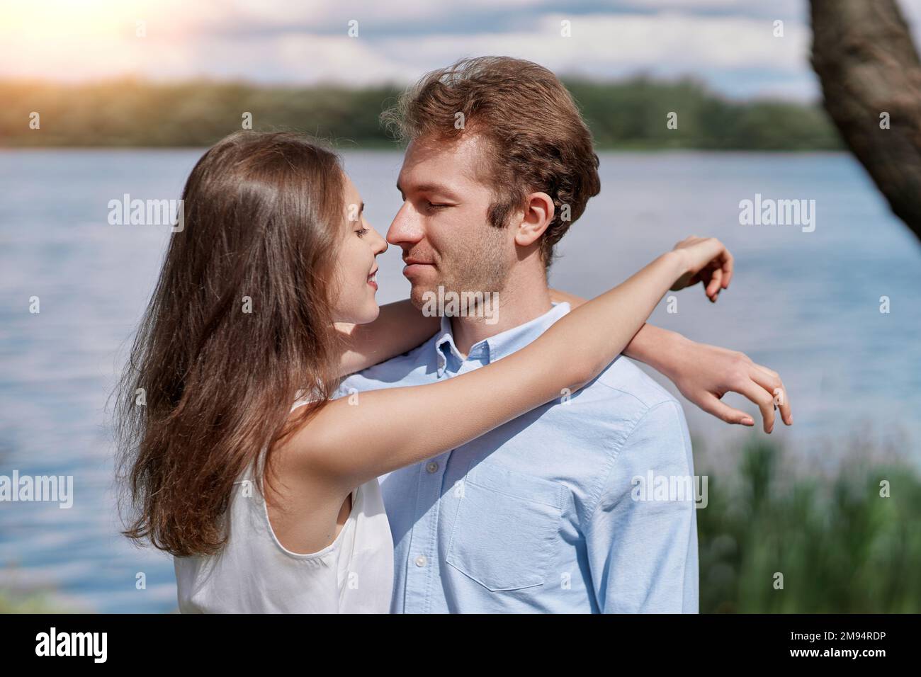 young couple kisses during a country walk . Stock Photo