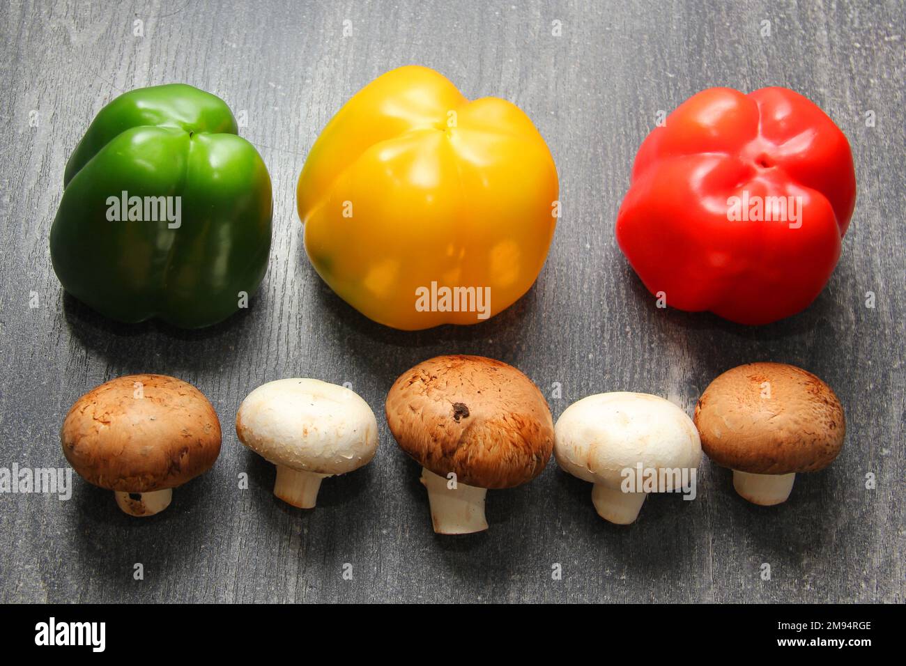 Colorful vegetables and peas, yellow, green and red peppers with ...