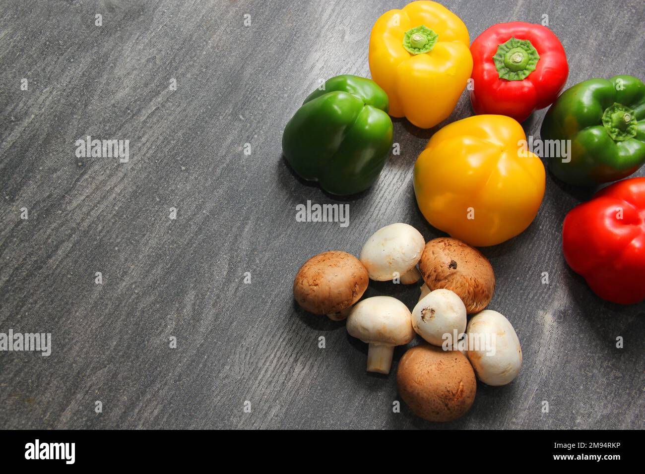 Colorful vegetables and peas, yellow, green and red peppers with ...