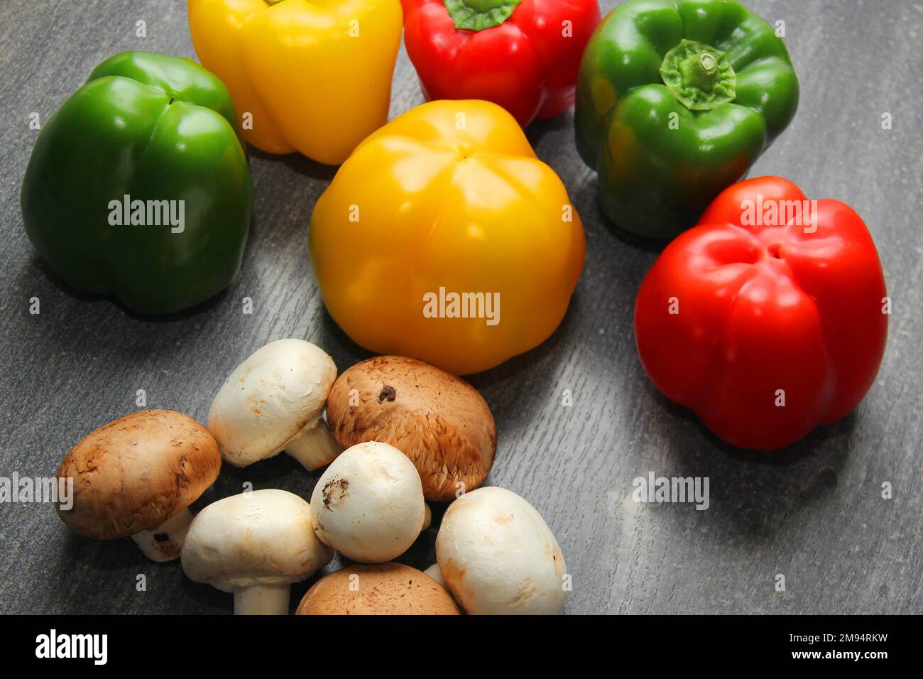 Colorful vegetables and peas, yellow, green and red peppers with ...