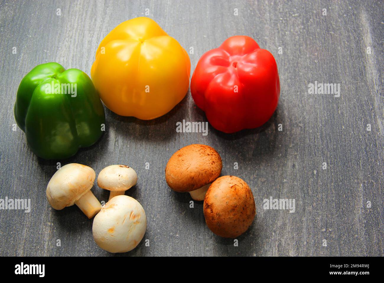 Colorful vegetables and peas, yellow, green and red peppers with ...
